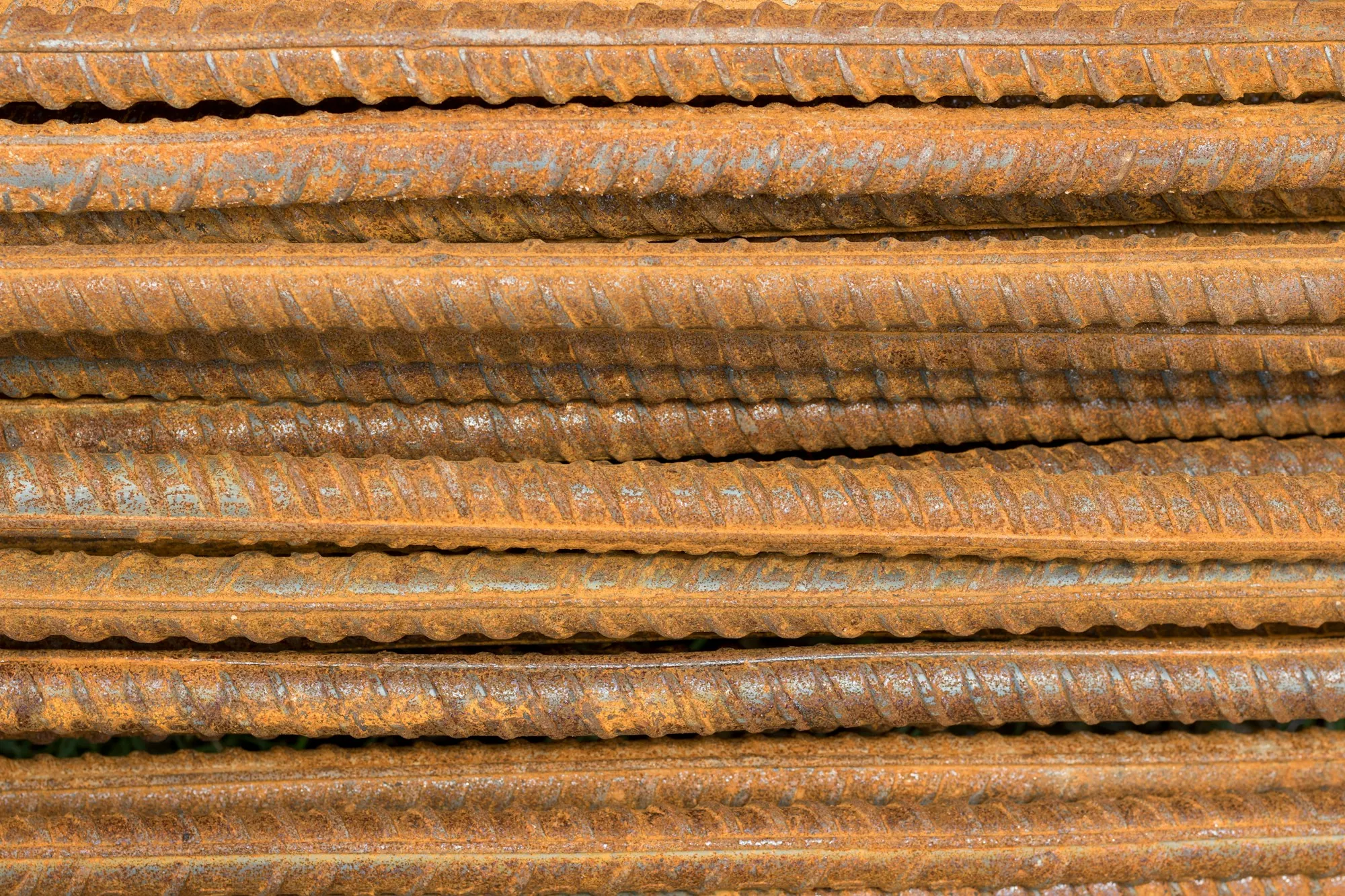 Stacked steel rebar close up