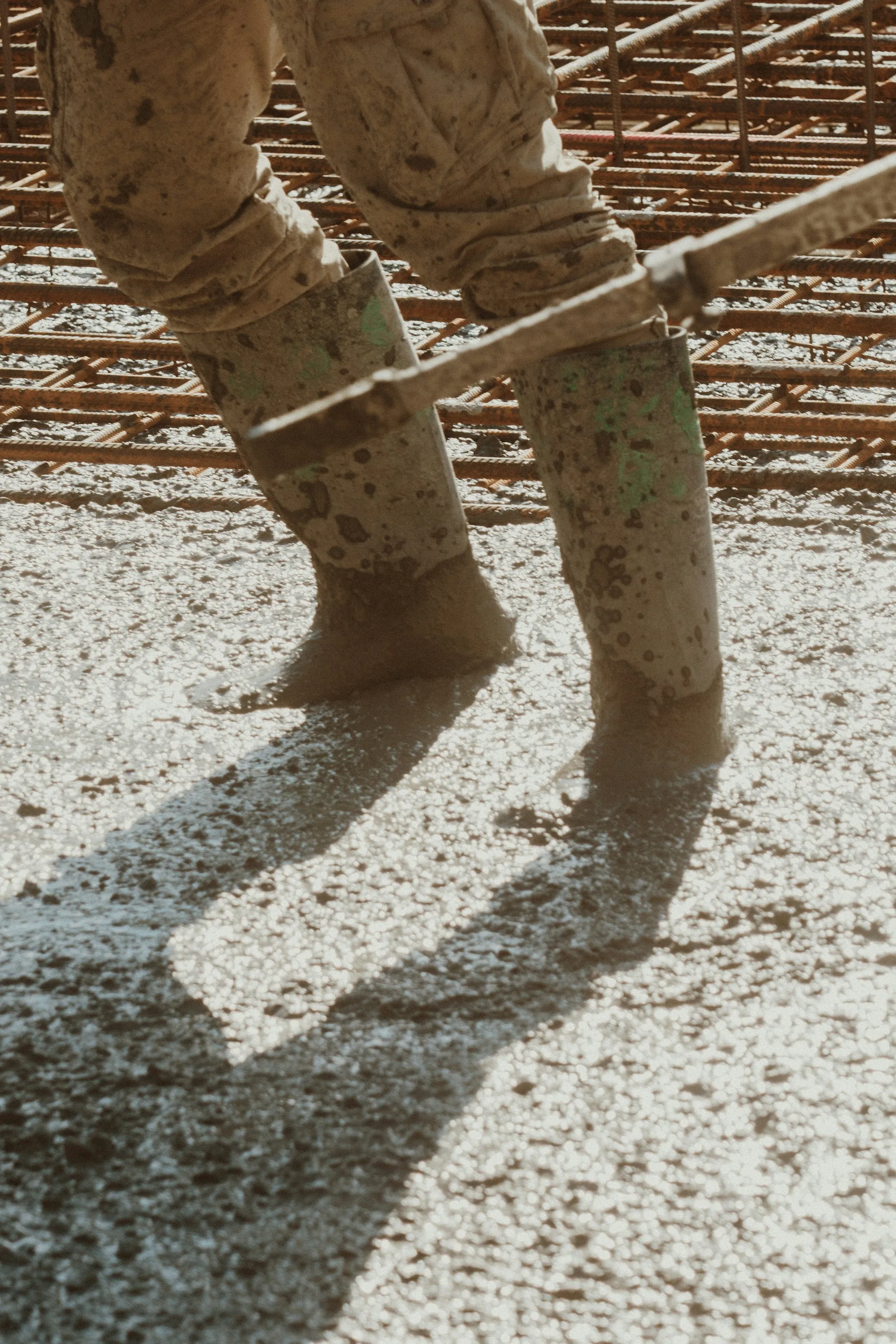 Work boots standing in freshly placed concrete